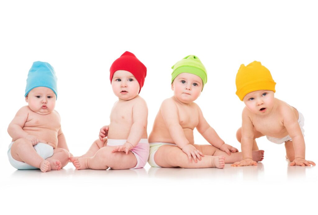 four babies with colorful toque 1